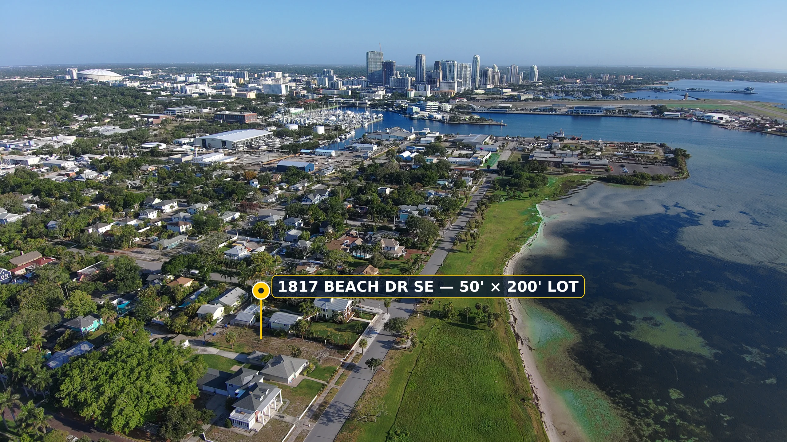 Contemporary Coastal Waterfront, wide aerial of the 50 by 200 foot homesite, Lassing Park shoreline and St. Petersburg skyline