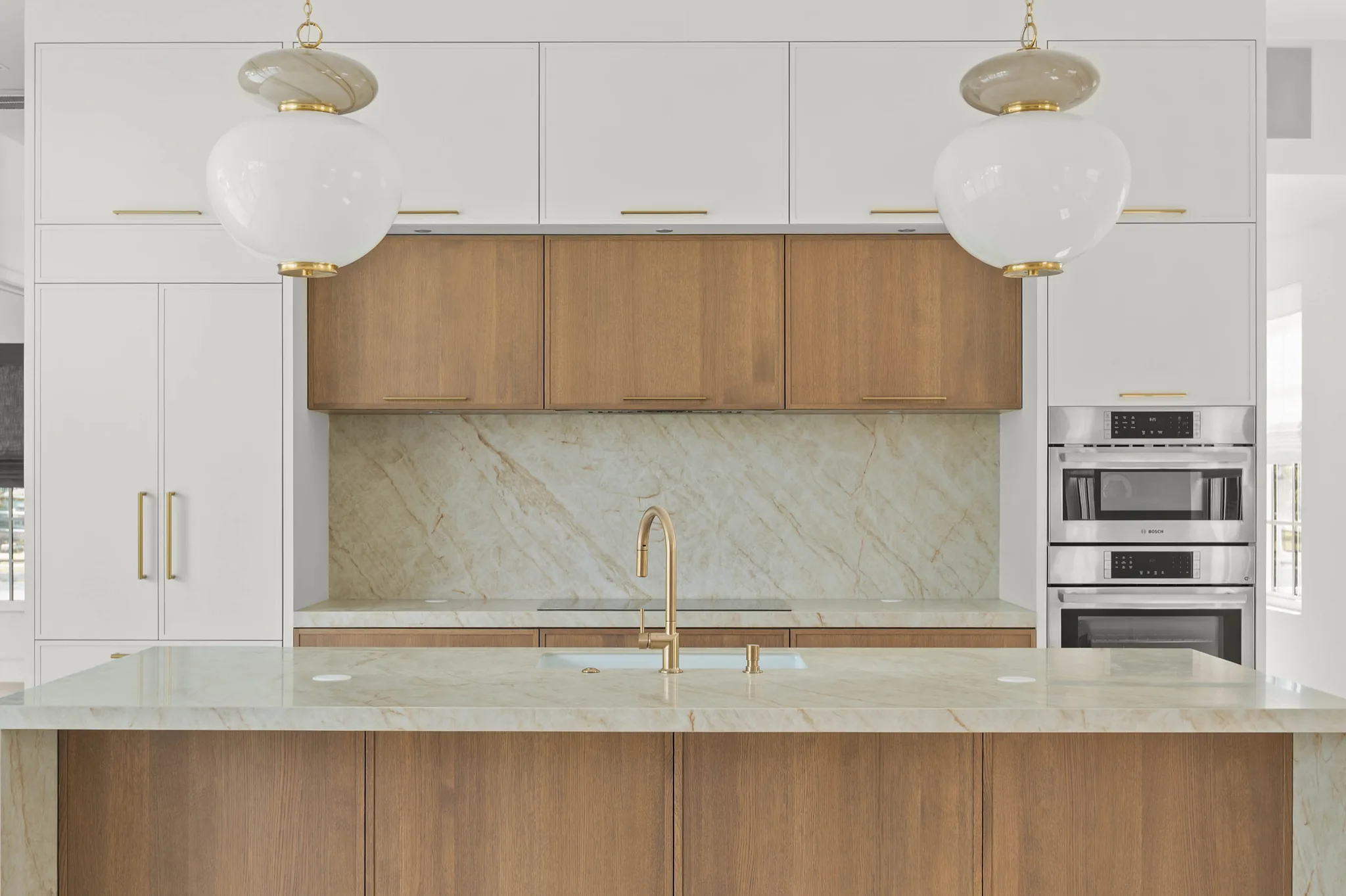 Kitchen perimeter with Bosch wall ovens and quartzite counters