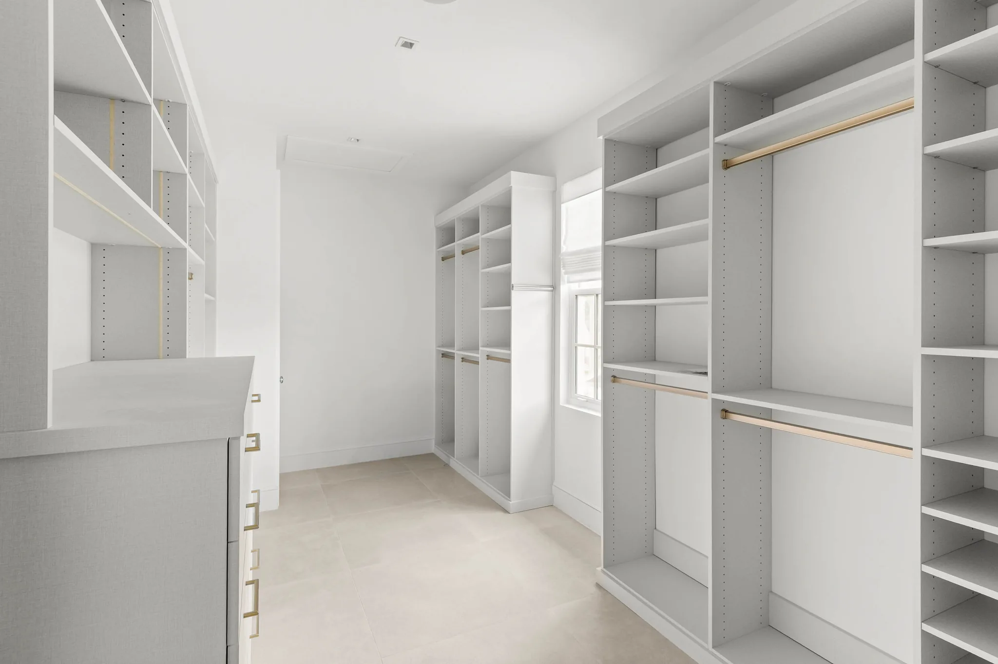 Primary walk-in closet with custom built-ins